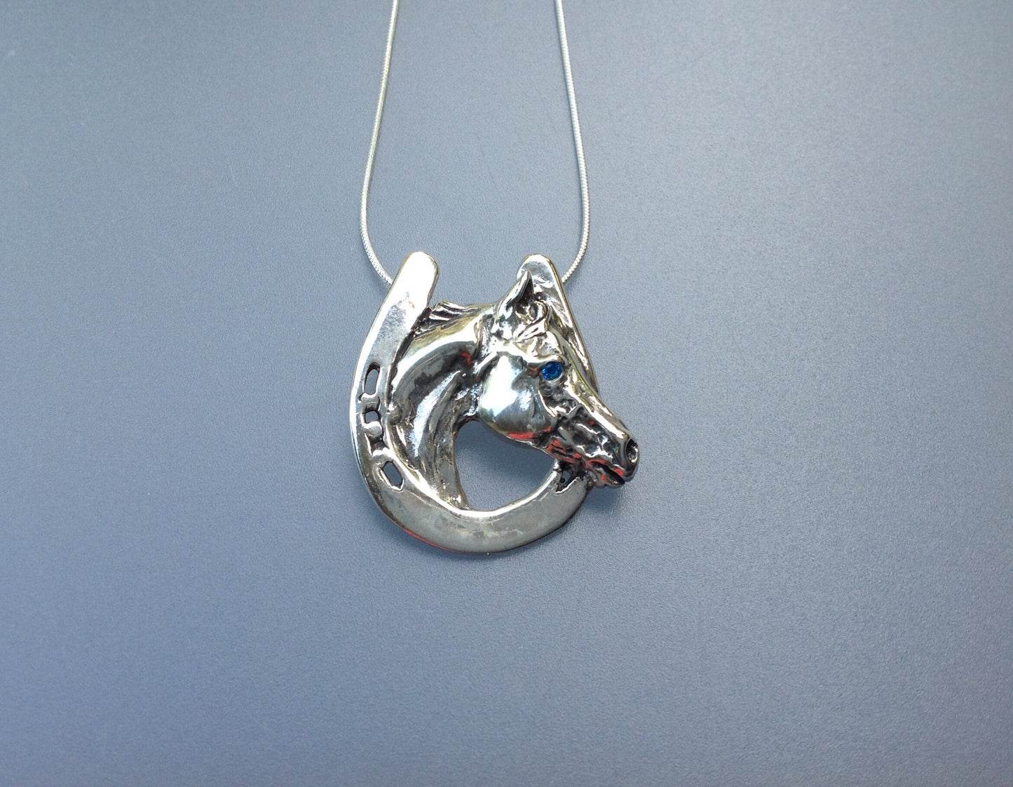 Horse in horseshoe  pendant with stone eye & chain  sterling silver  Forge Hill Sculpture jewelry