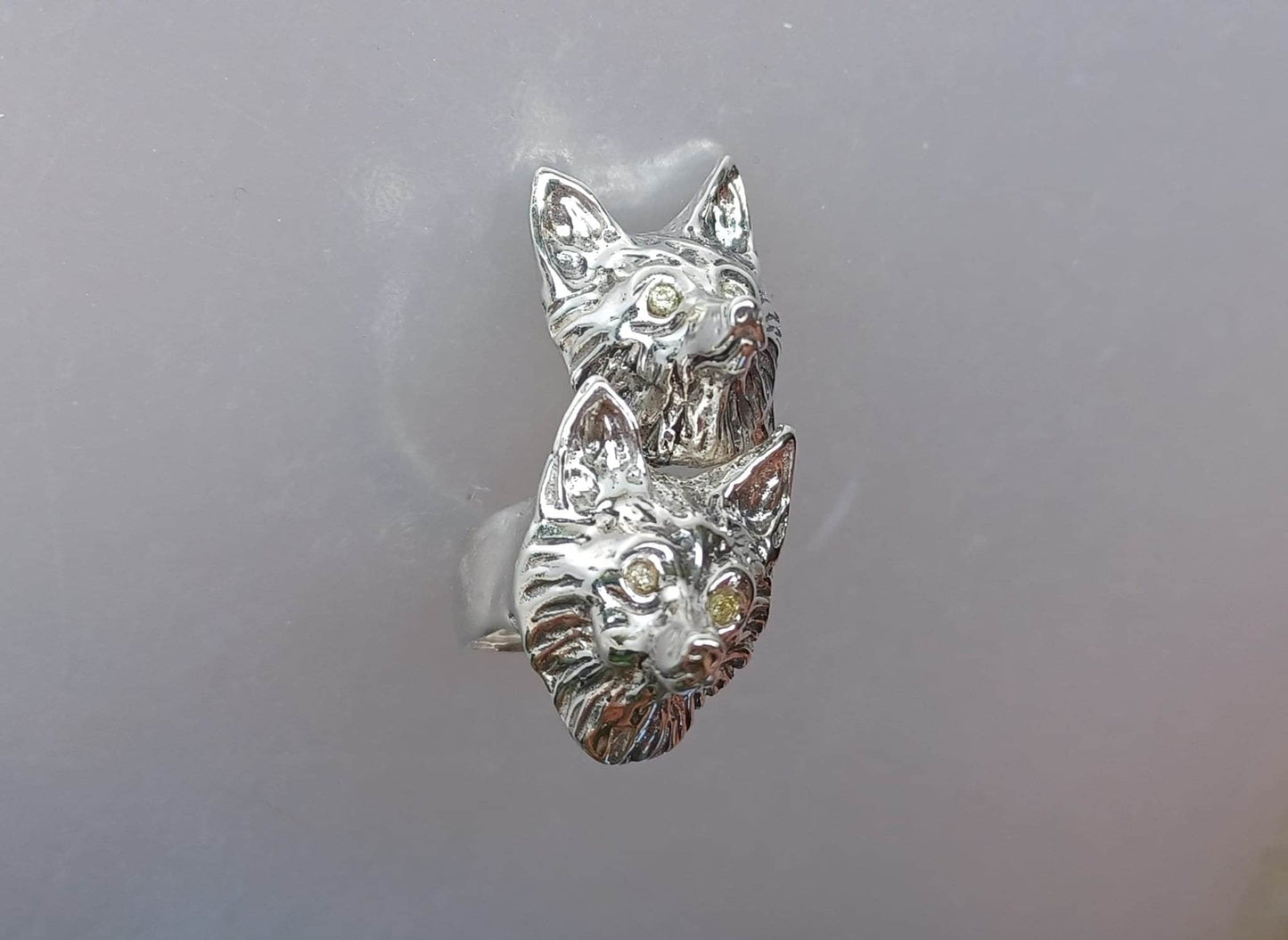 Foxes wrap ring adjustable from sizes 5,6,7,8,9 sterling silver Peridot stone eyes  Zimmer