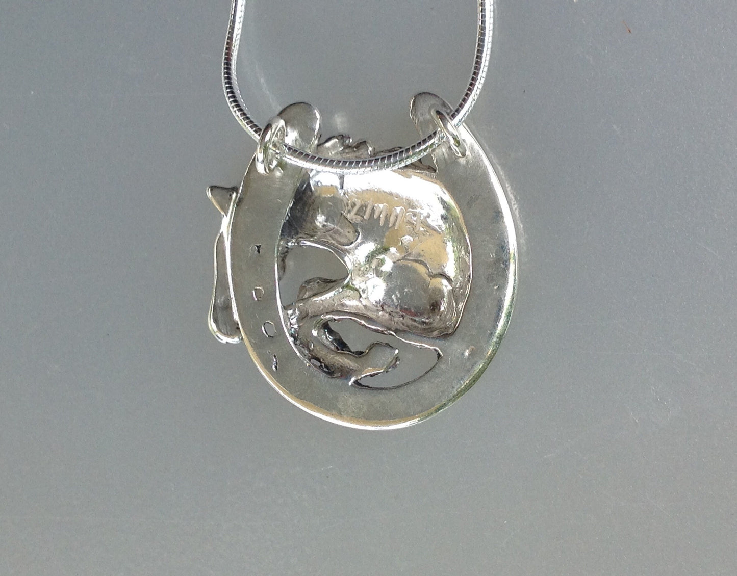 Jumper horse in horseshoe  pendant and chain.  Stone set eye. Sterling Silver Forge Hill Sculpture horse jewelry Zimmer