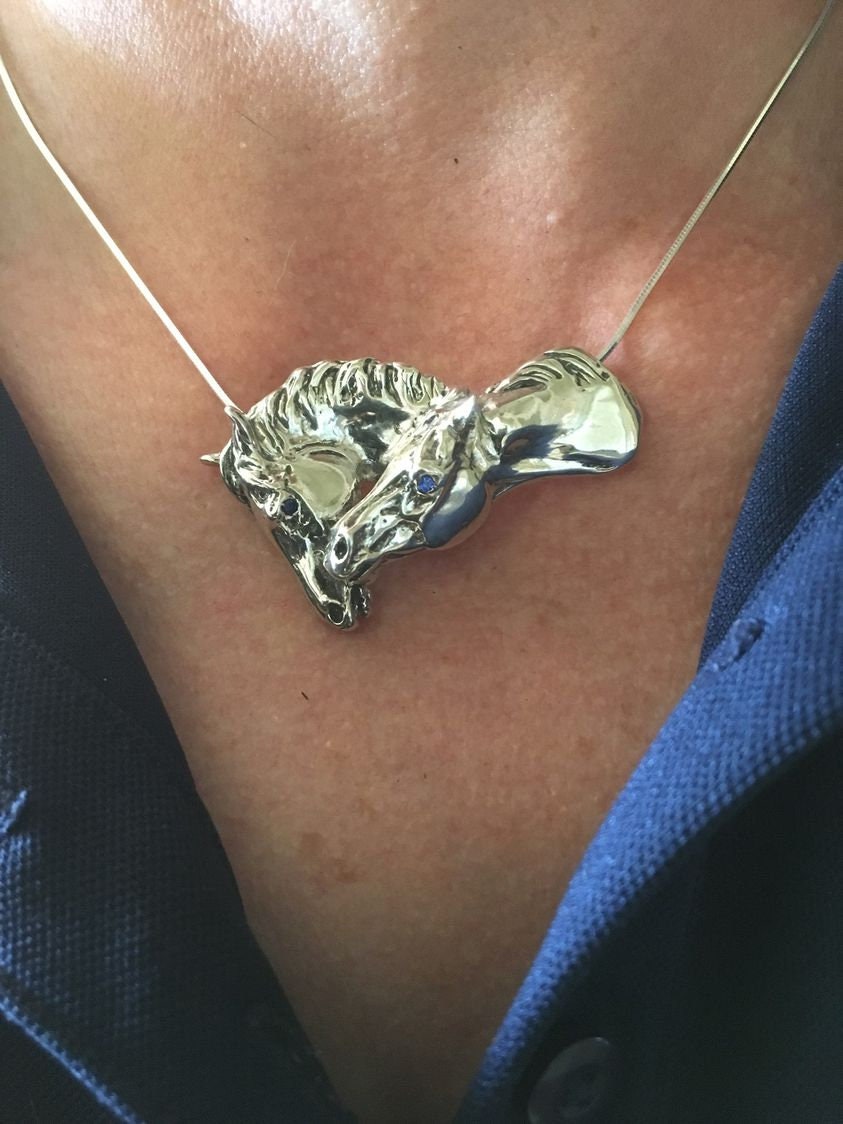 Sterling Silver nuzzling horses pendant and chain with your choice of stone eyes. Zimmer equestrian jewelry