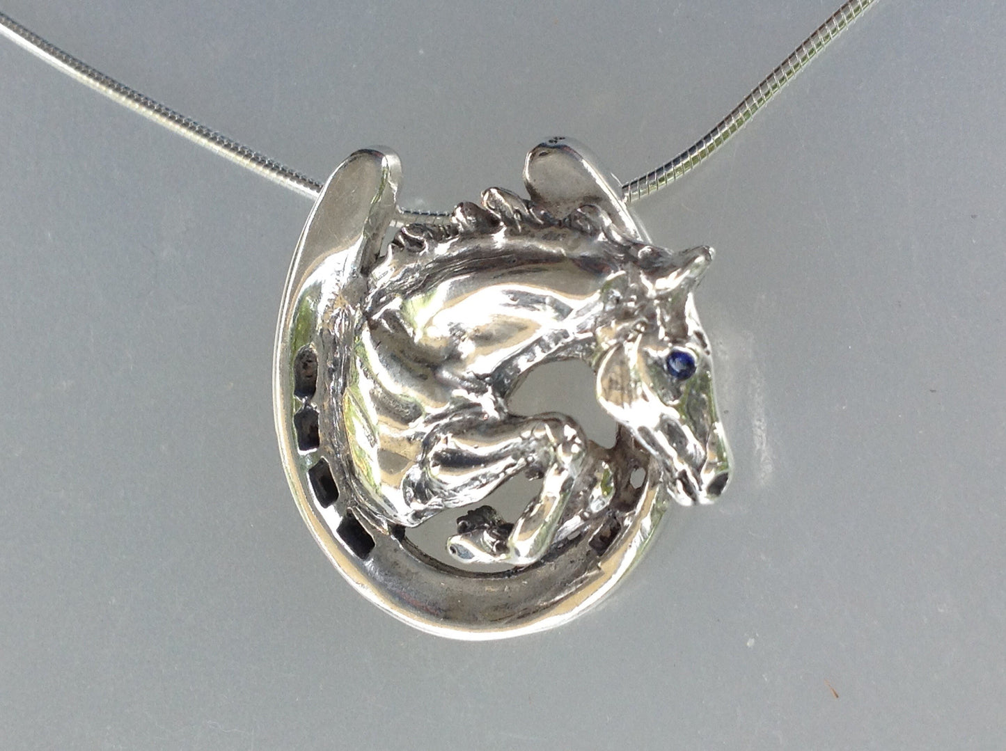 Jumper horse in horseshoe  pendant and chain.  Stone set eye. Sterling Silver Forge Hill Sculpture horse jewelry Zimmer