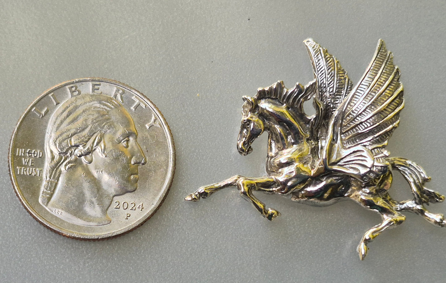 Pegasus Sterling silver pendant and stainless steel chain.