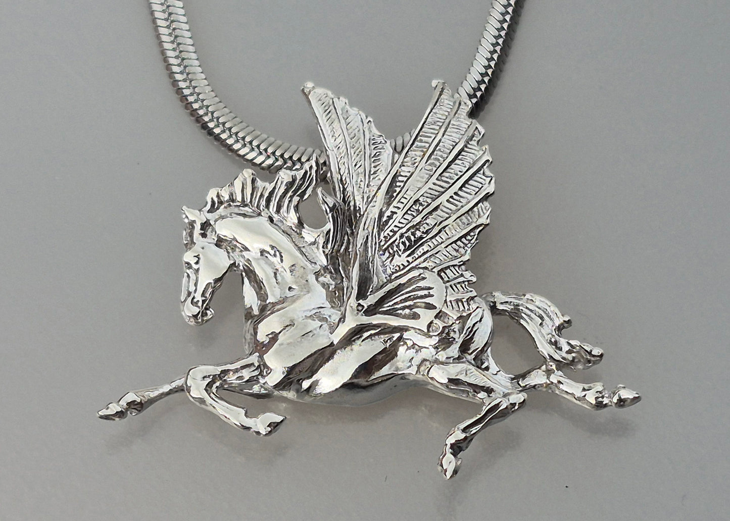 Pegasus Sterling silver pendant and stainless steel chain.
