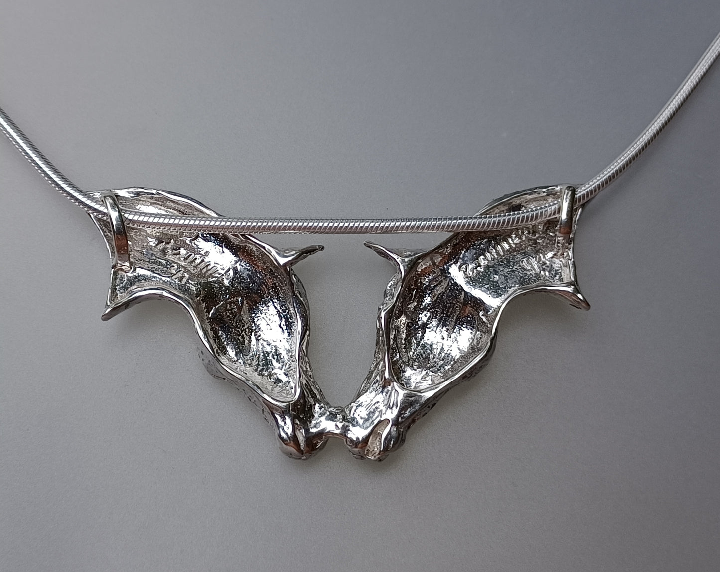 Nose to Nose pendant and chain Sterling Silver, Stone set Eyes. Sweet necklace from Forge Hill Sculpture.  Zimmer design 2023 (Copy)