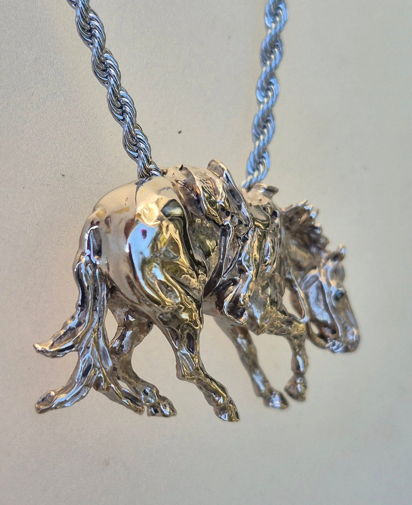 Cutting Horse with Western Saddle, stone set eyes cast in bronze, stainless steel chain