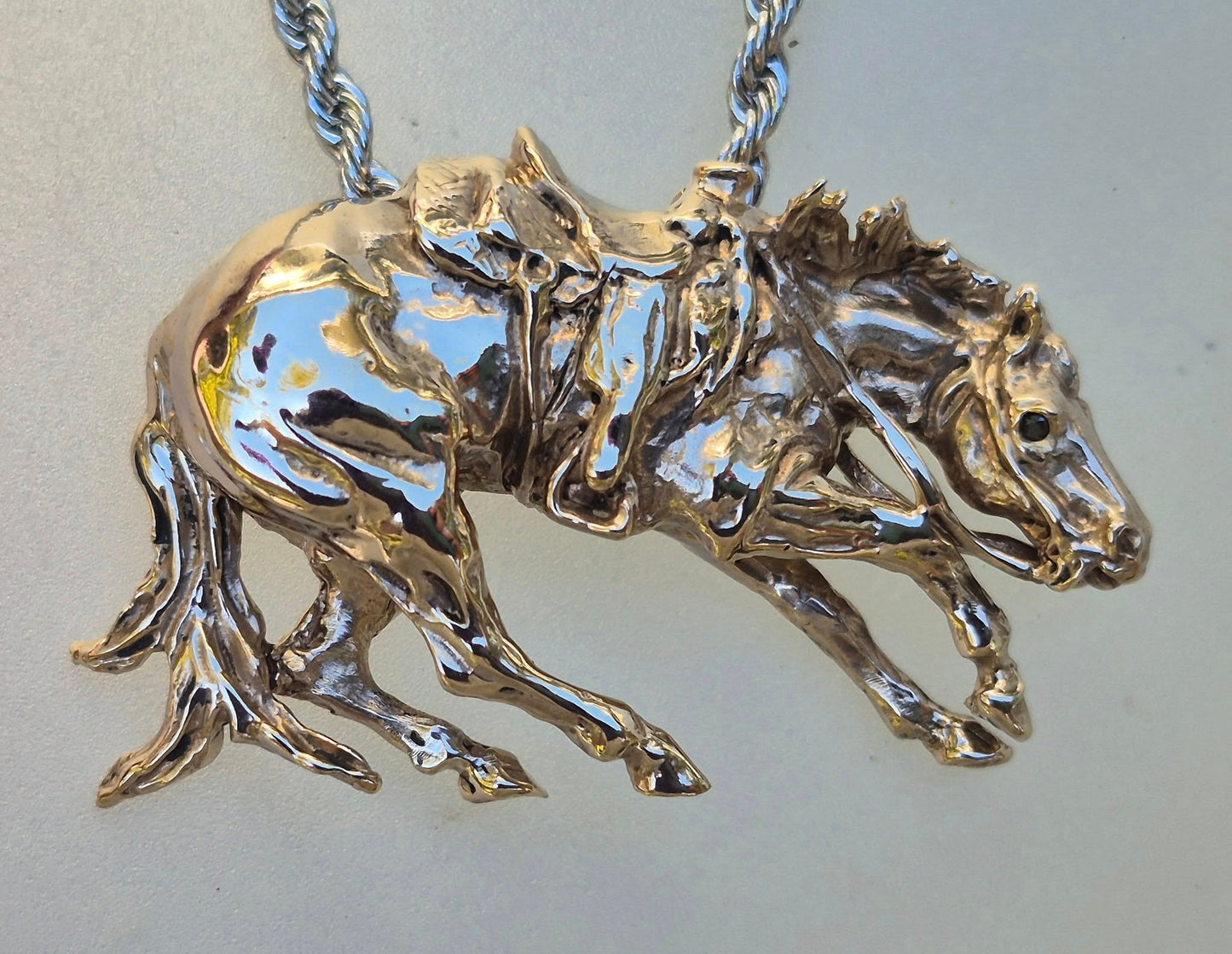 Cutting Horse with Western Saddle, stone set eyes cast in bronze, stainless steel chain